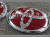 Toyota RAV4 (09-) оригинальные красные эмблемы на капот и заднюю крышку багажника, комплект 2 шт.